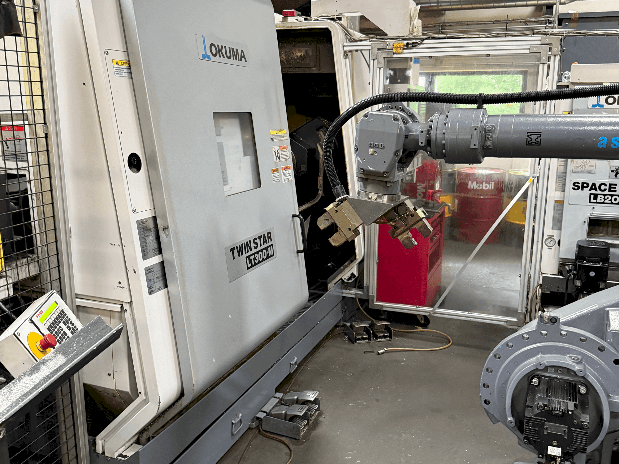 Вид станка Okuma Twinstar LT300-M спереди