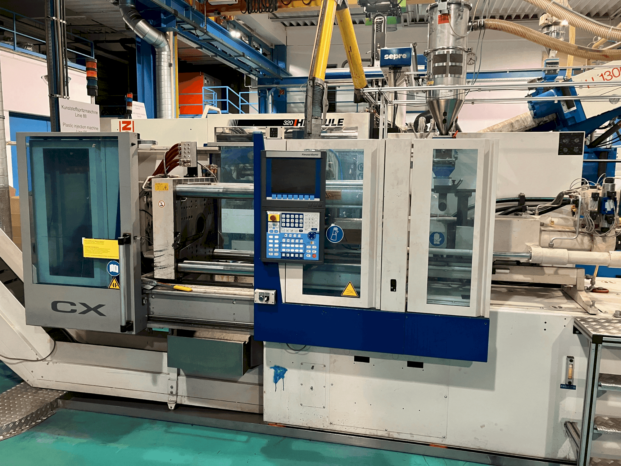 Вид станка Krauss Maffei 65-180 CX спереди