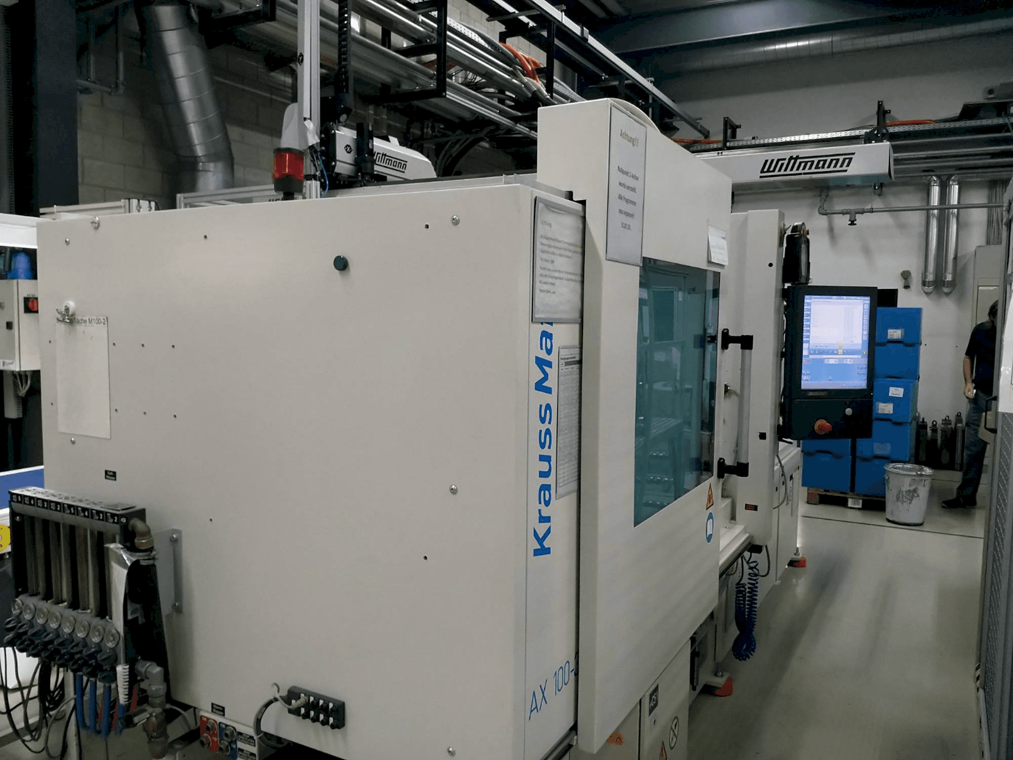 Front view of Krauss Maffei 100-380 AX machine