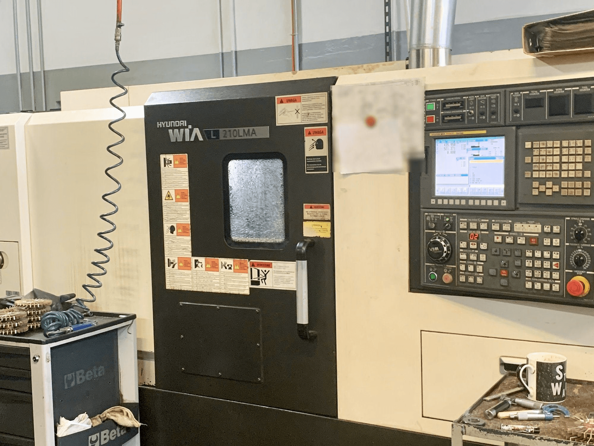 Вид станка Hyundai Wia L210LMA спереди