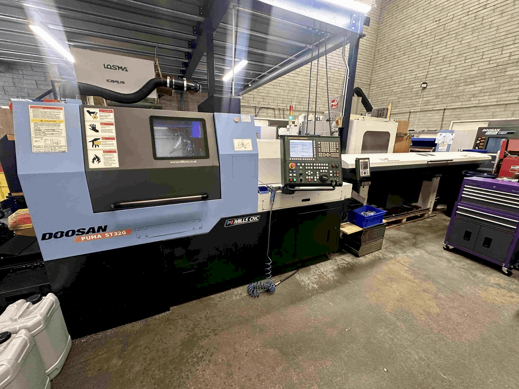 Вид станка DOOSAN Puma ST32G спереди