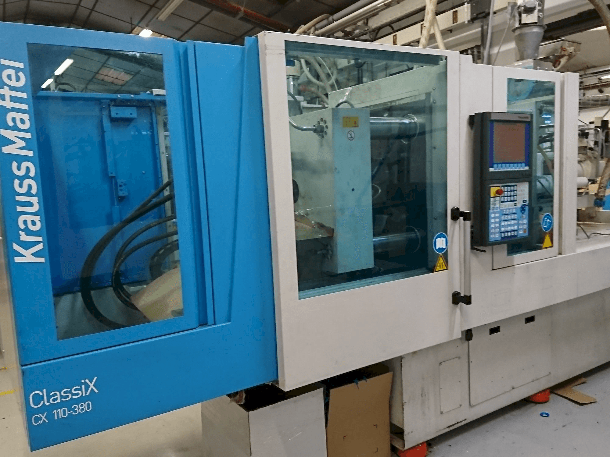 Front view of Krauss Maffei 110-380 CX machine