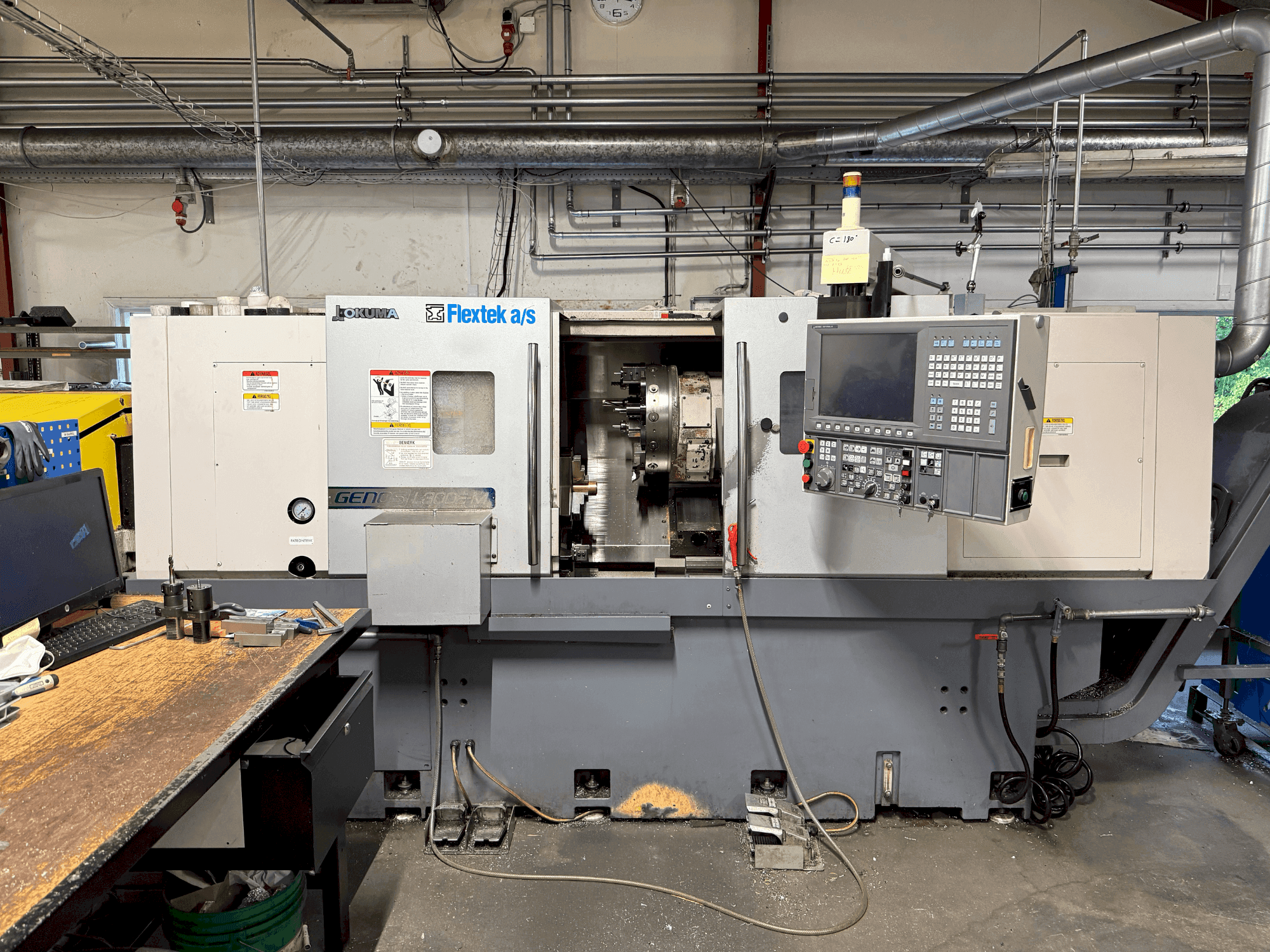 Вид станка Okuma Genos L300E-M with FMB Turbo 8-80 спереди