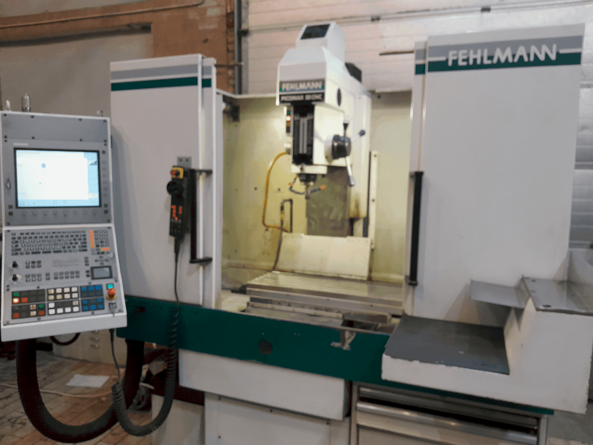 Вид станка FEHLMANN PICOMAX 55 CNC 2/3 спереди