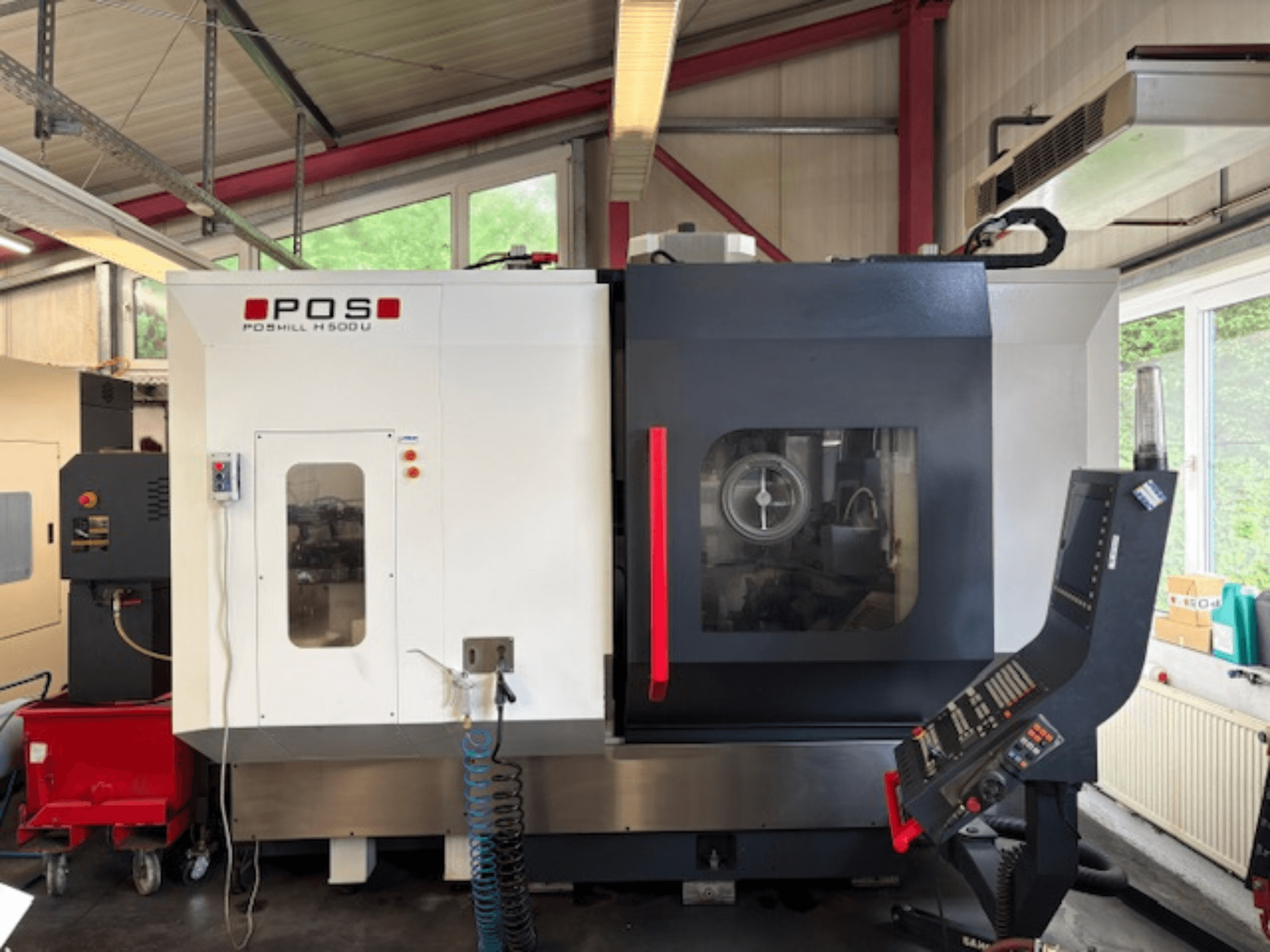 Фрезерный станок POS POMILL H500 U с видом спереди, с панелью управления и рабочим окном.