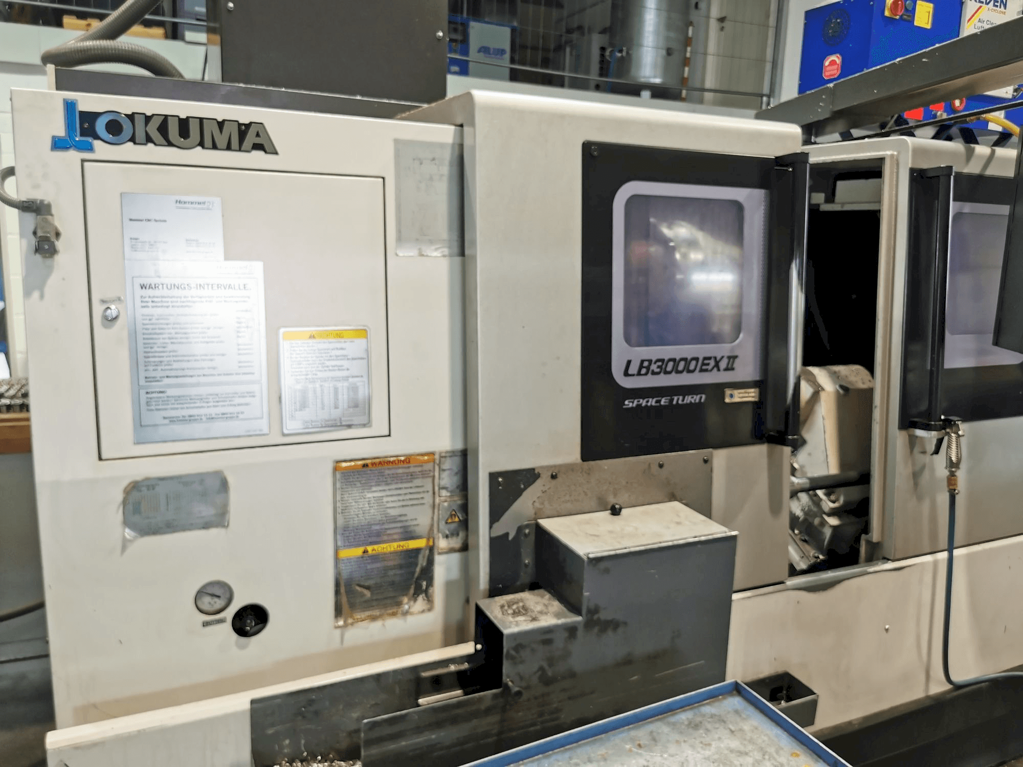 Вид станка Okuma LB3000ll EX MC 1000 спереди