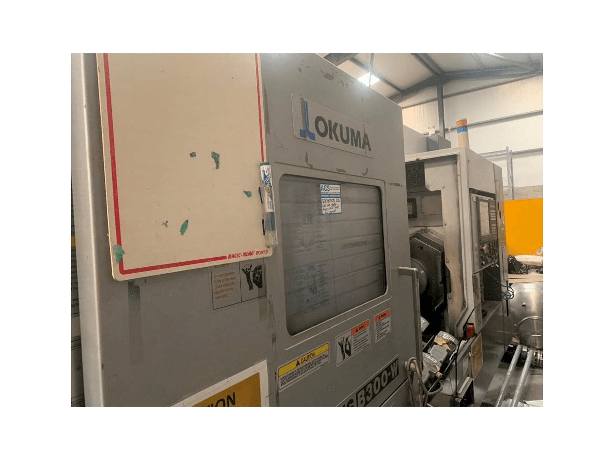 Front view of Okuma Multus B-300W machine